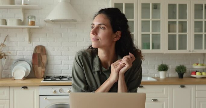 Business woman standing in kitchen consider over issue, journalist working on laptop search for inspiration and new ideas for article. Free time and internet, comfort telecommute job from home concept