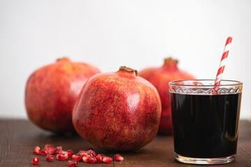 Fresh ripe pomegranate and juice in the glass. Close up