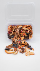 Dried fruit mix in box, apple, pear, plum, fig.
