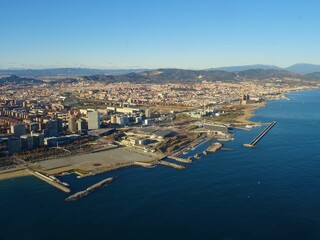 Port Forum Barcelona aerial view with blue sky, modern buildings, mountains, Sant Adria and Santa...