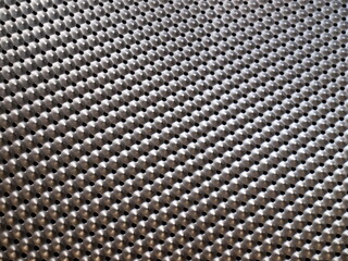 Perforated stainless steel. Inside the tank of the automatic washing machine. Focus closely and choose the subject.