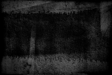 Fototapeta premium Cement old wall plaster in black and gray with a damaged surface covered with scratches, cracks and grains.