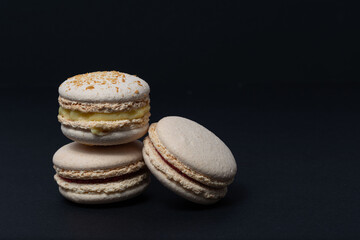 Appetizing macaroni of white color are located on a black background. Side view