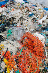 Garbage on a rocky beach in the Pacific Ocean. death and environmental destruction. pollution of the planet.