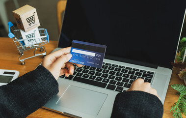 Close up of Asian Business Woman Hand using credit card for work in the office room, business,SME,shopping online concept.