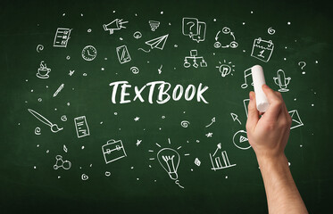 Hand drawing TEXTBOOK inscription with white chalk on blackboard, education concept