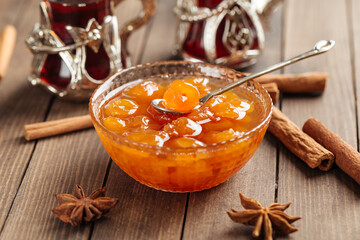 White cherry jam in bowl on wooden background
