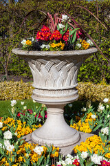 Regents Park spring urn flower display in a floral flower bed which is a popular public open space...