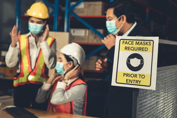 Caution sign in factory warning to industry labor worker to prevent Covid-19 Coronavirus spreading...