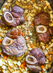 Osso buco in bianco veal meat and root vegetables