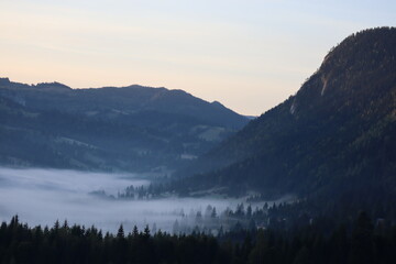 Naklejka na ściany i meble Morning fog in the Carpathians mountains, landscape, Red Lake area, Romania