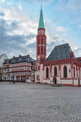 Fototapeta na wymiar Frankfurt am Main, Hessen, Germany, Europe, The 12th-century church dedicated to St. Nicholas, the 12th-century chapel is located in the Römerberg square, right next to the half-timbered houses.