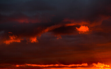 Fototapeta premium Beautiful sunset. Red and black clouds in the sky