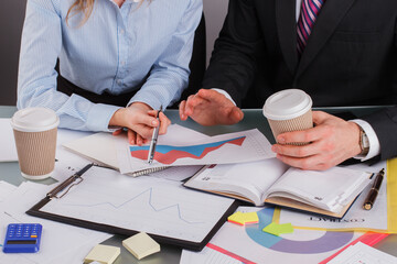 Business people drinking coffee while discussing and brainstorming in office. Business partners...