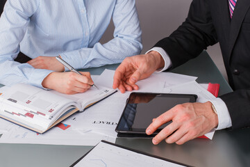 Business partners working together at office. Business people working with new startup project close up. Strategic business planning.