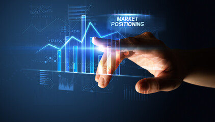 Hand touching MARKET POSITIONING button, business concept