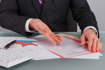 Close up businessman checks the financial profit of the company. Close up businessman analyzing...
