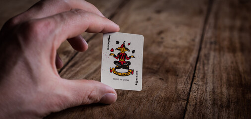 Hand holding Joker Wild Card | Playing Cards | Gambling | Gambler | Poker Game
