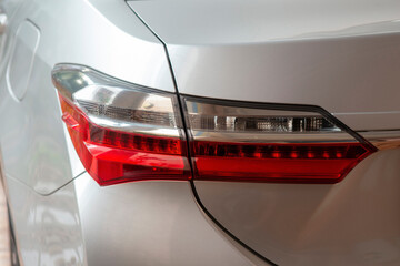 Modern sedan tail lights come in two red and white colors in the same lamp.