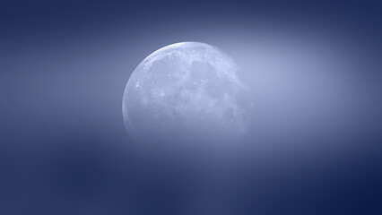 Night sky with moon in the  blue clouds