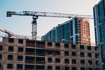 high-rise builders build   site overlapping collective building industry professional crane