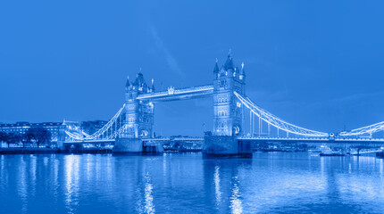 Naklejka premium Panorama of the Tower Bridge and Tower of London on Thames river at twilight blue hour 