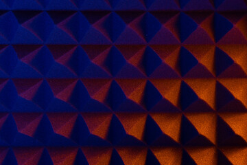 Abstract pyramid background in colored light.