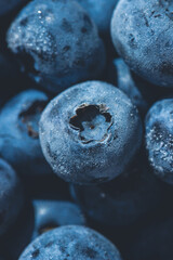 Frozen blueberry fruits, organic and vegan food. berries background. close up, top view