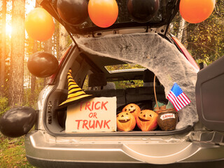 Trick or trunk. Concept celebrating Halloween in trunk of car. New trend celebrating traditional...