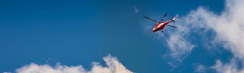 Selbstklebende Fototapeten Polish TOPR helicopter - Mountain Rescue helicopter in action © lukasz_kochanek