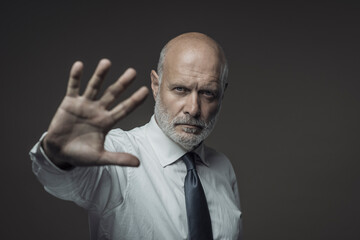 Business executive making a stop gesture