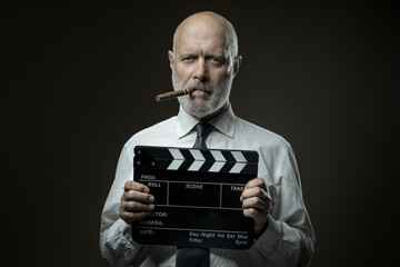 Film director holding a clapperboard