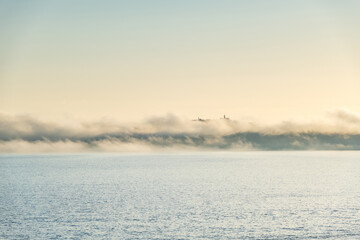 Panorama view of Ons and Onza islands in the Ría de Pontevedra in Galicia under heavy fog, Spain.