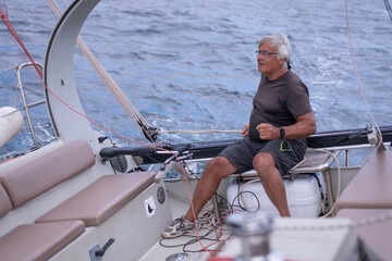 A man sailing a boat in the Mediterranean Sea