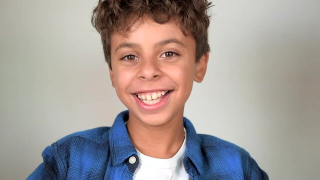 Latin america  kid smiling, looks at the camera