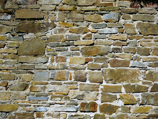 Stary kamienny mur ze średniowiecznego zamku jako tło