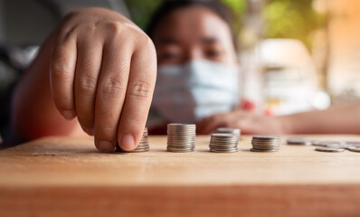 Food vendor woman hands counts the money or saving money.