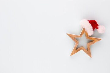 Fototapeta na wymiar Christmas star with santa hat decoration. Christmas star on blue background.