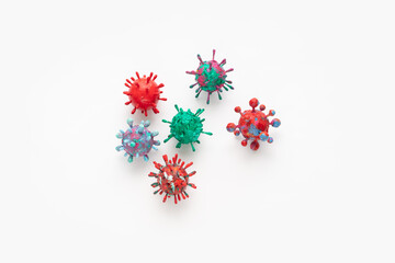 A photograph of a collection of six colorful 3D Virus artwork model forms. Inspired by the Covid-19 lockdown of 2020