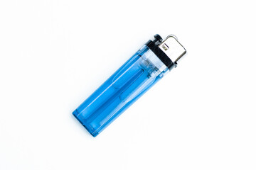 Blue plastic lighters on white background top view.