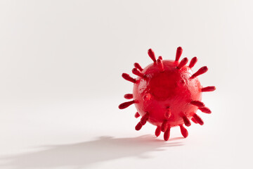 A photograph of a large red virus sculpture. The artwork inspired by the Covid-19 lockdown of 2020