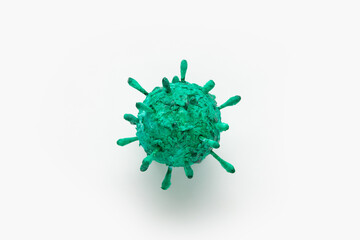 A photograph of a green virus sculpture. The artwork inspired by the Covid-19 lockdown of 2020