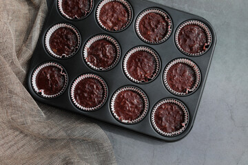 Preparation homemade zucchini muffins with chocolate. Ketogenic diet concept. Flat lay. Copy space.