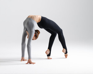 Young gymnast girl stretching and training