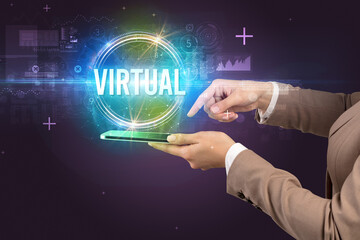 Close-up of a touchscreen with VIRTUAL inscription, new technology concept