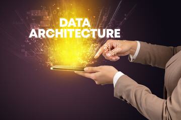 Close-up of a touchscreen with DATA ARCHITECTURE inscription, innovative technology concept