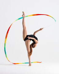 Young gymnast girl stretching and training