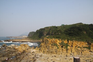 Fototapeta na wymiar Beautiful view of the blue sea and the rock in the beach