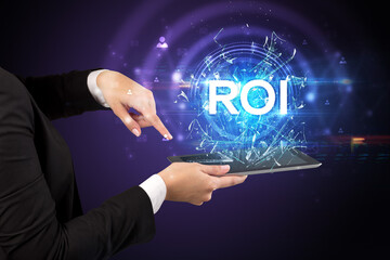 Close-up of a touchscreen with ROI abbreviation, modern technology concept