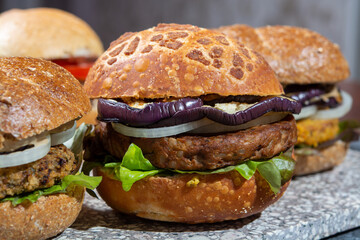 Healthy vegan or vegetarian fast food, fresh made plant based burgers with vegetables